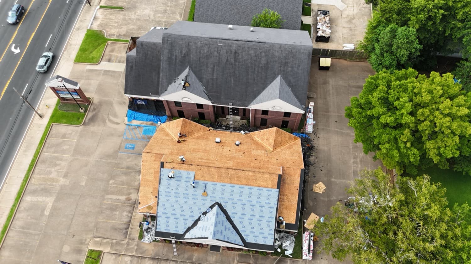 Commercial building reroof in progress with new underlayment
