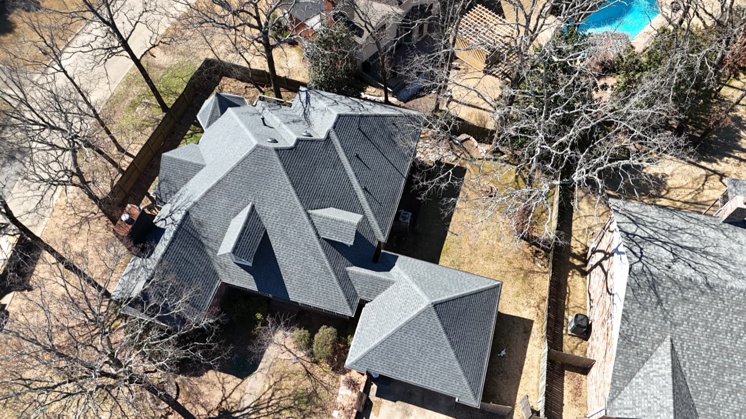 Large estate with a complex architectural shingle roofline