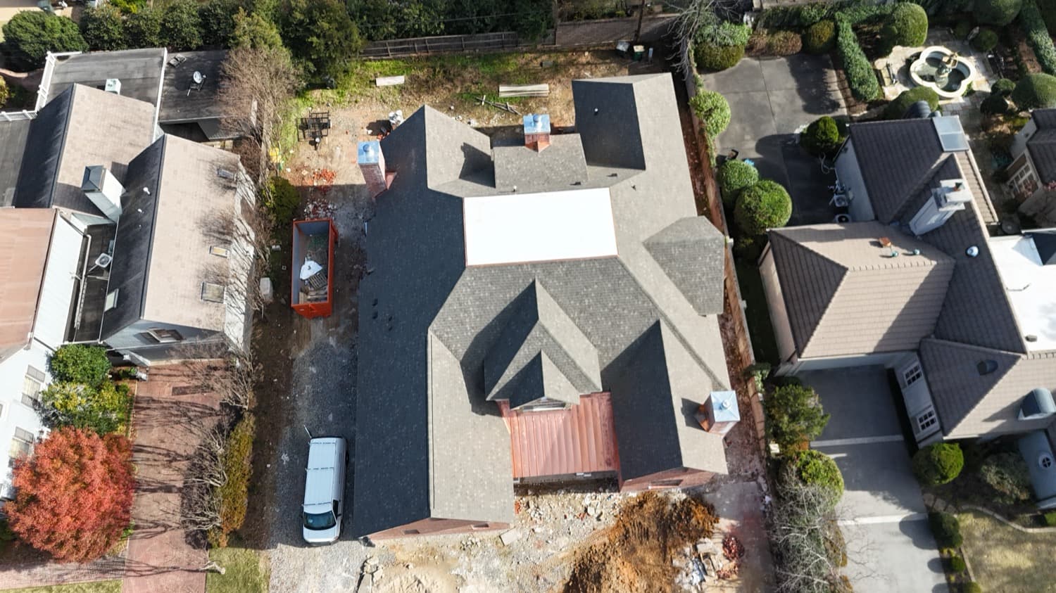 Estate roof combining a low-slope membrane section with architectural shingle