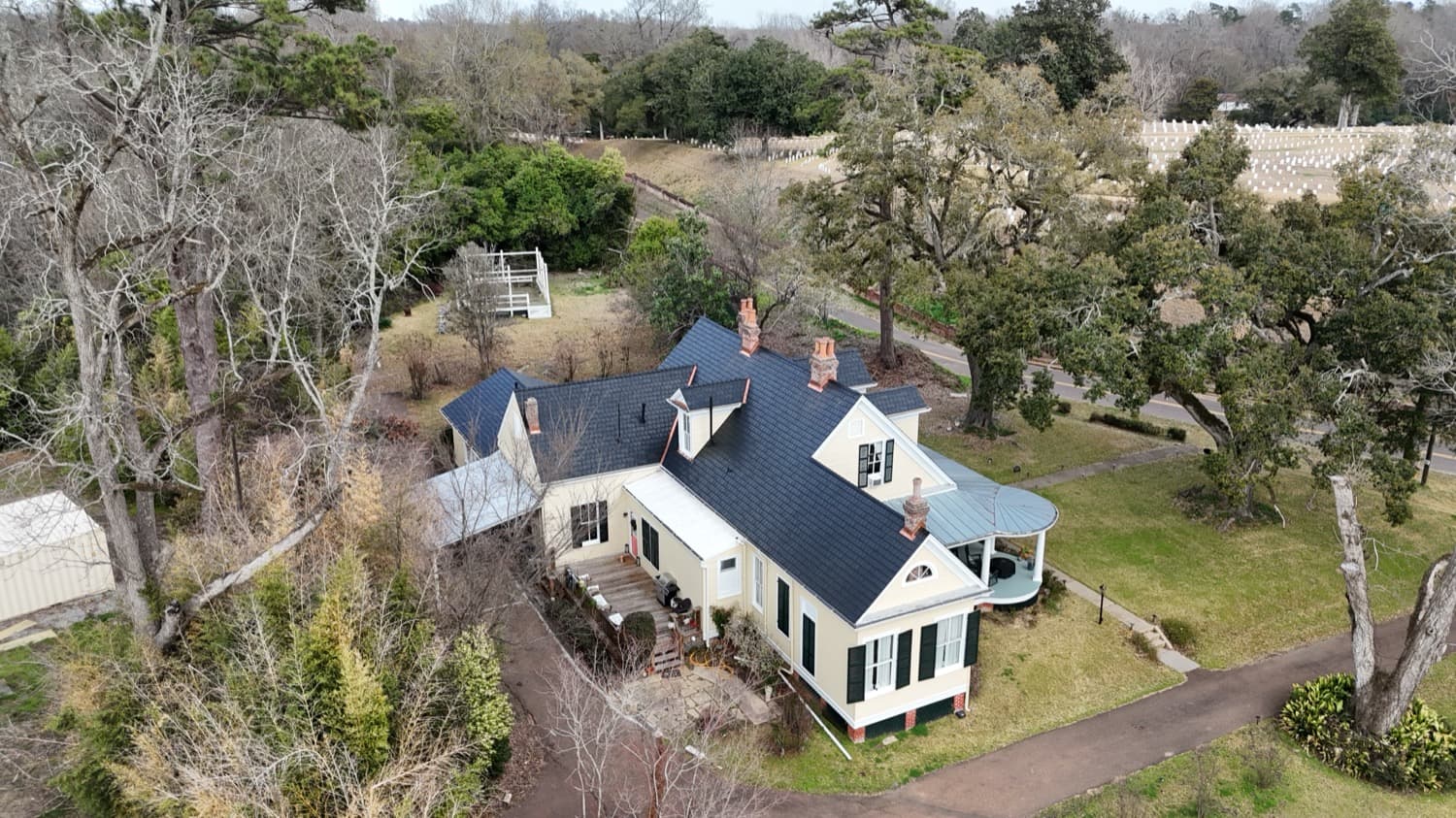 Historic home with a slate roof and copper flashing detail
