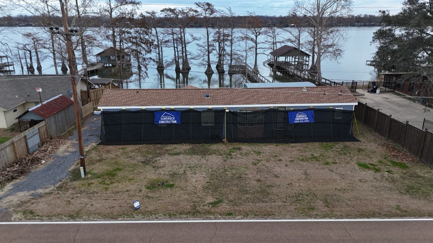 Lakefront home reroof with protective coverings during the project